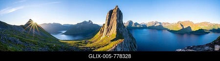 Sun rising over Bergen, morning atmosphere, steep mountain Segla, fjord Mefjorden with Bergen, island Senja, Troms, Norway-stock-foto