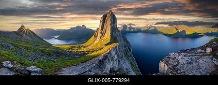 Sun rising over Bergen, dramatic clouds, morning atmosphere, steep mountain Segla, fjord Mefjorden with Bergen, island Senja, Troms, Norway-stock-foto