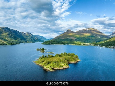 Aerial view of the western part of the freshwater loch Loch Leven with the historic island of EileanMunde, above it the 742 metre high Pap of Glencoe, Highlands, Scotland, United Kingdom-stock-foto