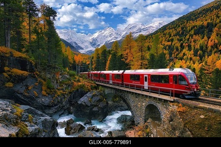 Rhaetian Railway RhB crossing a mountain stream over a stone bridge, behind it autumn-coloured Val Morteratsch with snow-covered mountains, Engadine, Canton Grisons, Switzerland-stock-foto
