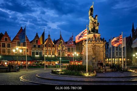 Bruges, Belgium, May 29, 2018: Bruges Grote markt square famous tourist place with many cafe and restaurants and Jan Breydel and Pieter de Coninck Monument in the evening-stock-foto