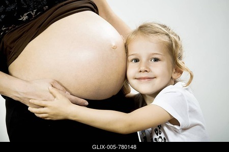 Girl and belly of pregnant mother-stock-foto