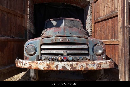 Rusted vintage Opel Blitz 1960, in opening of a garage, Niederrhein, North Rhine-Westphalia, Germany-stock-foto