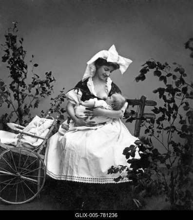 Wet nurse suckling a baby, historic photograph, around 1910-stock-foto