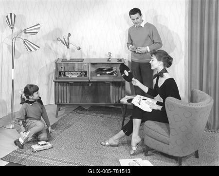 Family in the living room in front of the stereo, historical photo, circa 1955-stock-foto