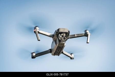 Flying quadrocopter, remote controlled drone with camera, DJI Mavic-stock-foto