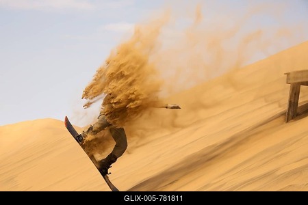 Sand boarding in the dunes of the Namib Desert, near Swakopmund, Namibia-stock-foto