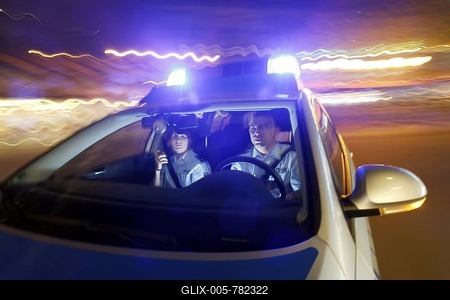 Police patrol car driving with flashing lights and sirens, Germany, Europe-stock-foto