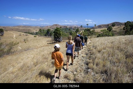 A ranger in the national park with tourists, Komodo National Park, UNESCO World Heritage Site, Komodo, Indonesia, Southeast Asia-stock-foto