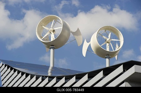 Solar panels and mini wind turbines on the roof of a hotel in Freiburg, Breisgau region, Baden-Wuerttemberg, Germany, Europe-stock-foto