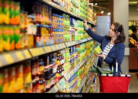 Woman purchasing canned vegetables in a self-service grocery department, supermarket, Germany, Europe-stock-foto