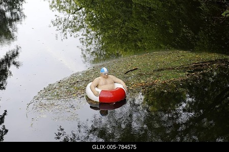 "Floating tire man" by Christel Lechner, 2009, in the river Ems, Telgte, North Rhine-Westphalia, Germany, Europe-stock-foto