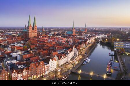 Aerial view over the river Trave and church towers in the old town of the Hanseatic City of Lübeck at sunset, Schleswig-Holstein, Germany-stock-foto
