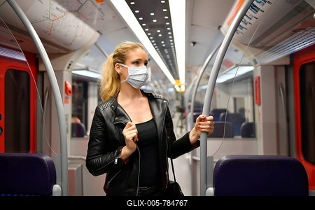 Woman with face mask, standing in suburban train, corona crisis, Stuttgart, Baden-Württemberg, Germany-stock-foto