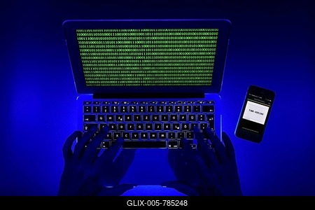 Smartphone for Push-TAN input next to computer keyboard, hands, symbol image cybercrime, hacker attack, Baden-Württemberg, Germany-stock-foto