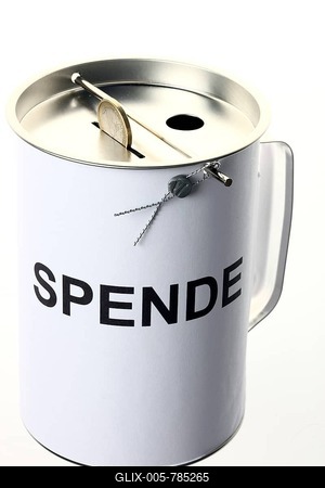 Donation box labeled Spende, German for donation, with slots for coins and bills, with a security seal to protect against unlawful opening-stock-foto