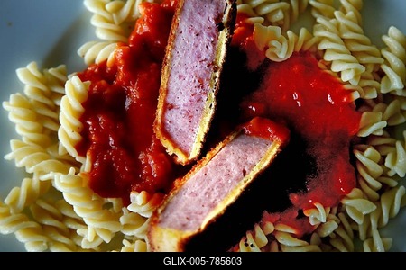 Jägerschnitzel with spirelli noodles and tomato sauce, GDR cuisine, GDR classic, East Jägerschnitzel, breaded sausage slice, Jules Verne Studio Berlin, Germany-stock-foto