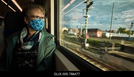 Elderly woman with a face mask, sitting on the S-Bahn, corona crisis, Stuttgart, Baden-Württemberg, Germany-stock-foto