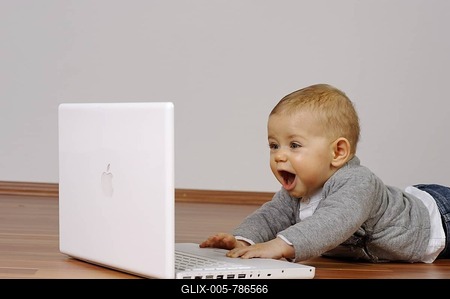 6-month-old infant with a laptop-stock-foto