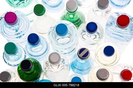 Different varieties of mineral water in bottles made of glass and plastic or PET-stock-foto