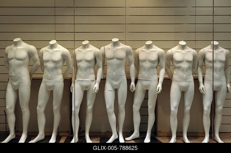 Seven naked white mannequins in a fashion store-stock-foto