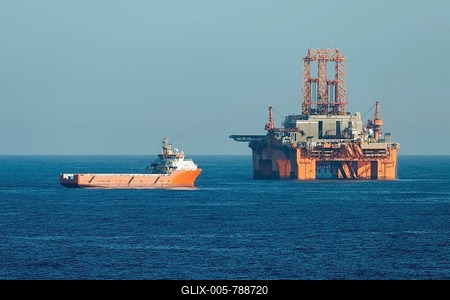 Supply vessel Normand Aurora next to West Phoenix oil rig, oil extraction, North Sea-stock-foto