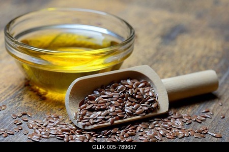 Linseed ( Linum usitatissimum) in shovel and linseed oil-stock-foto