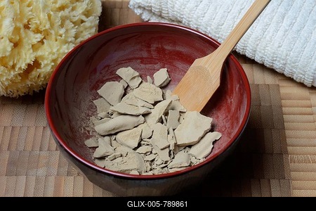 Dried healing clay in bowl, red clay, clay, healing clay powder-stock-foto