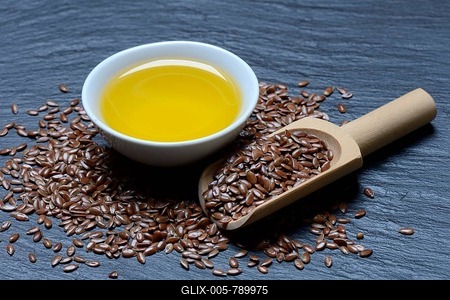 Linseed ( Linum usitatissimum) and linseed oil in small bowls-stock-foto