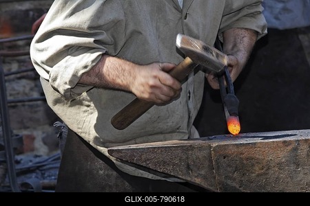 Smith in historical costume working glowing iron with his hammer, traditional craft market, Flachsmarkt Burg Linn, Krefeld, Lower Rhineland, North Rhine Westphalia, Germany, Europe-stock-foto
