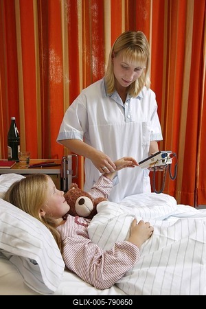 Nurse taking pulse rate of a young patient, 7 years, in hospital-stock-foto