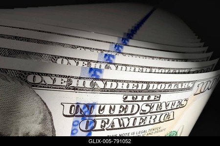 Spot lit abstract close-up angle of U.S. 100 dollar bills isolated on a black background-stock-foto