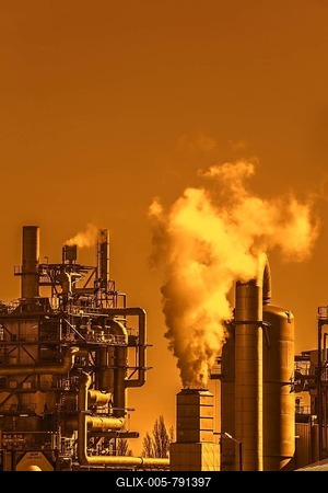 Industrial estate at sunset with orange sky showing BASF chemical production site in the port of Antwerp, Belgium-stock-foto