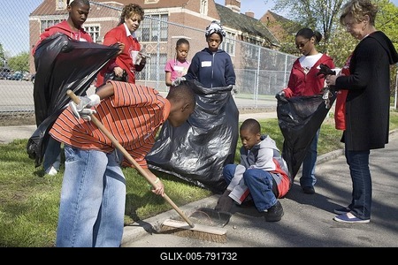 Students from Guyton Elementary School clean the streets outside their school, part of the annual city wide volunteer cleanup effort, Detroit, Michigan, USA-stock-foto