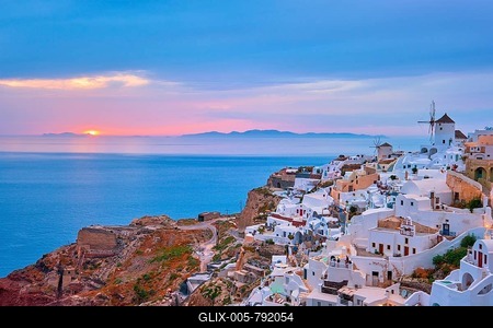 Famous greek iconic selfie spot tourist destination Oia village with traditional white houses and windmills in Santorini island on sunset in twilight, Greece-stock-foto