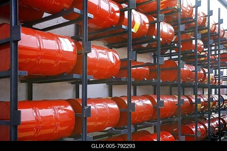 Shelved oil barrels at a refinery-stock-foto