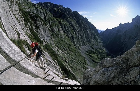 Woman climbing the via ferrata to Zugspitze Hoellental Germany-stock-foto