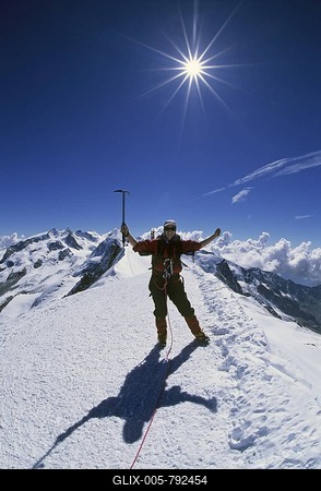 Woman on the summit of Breithorn Wallis Switzerland-stock-foto
