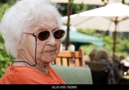 Portrait of a senior citizen, 97, in a garden restaurant in summer-stock-foto