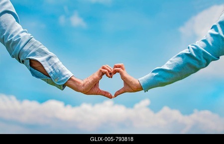Hands of a couple in love in the field making a heart shape, couple in the field making a heart shape with hands, Close up of hands of a couple making a heart shape with hands-stock-foto