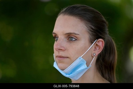 Woman wearing a face mask under the chin, portrait, Corona crisis, Germany-stock-foto