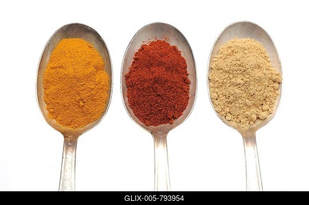 Spices on old spooks, curry, paprika and ginger powder-stock-foto