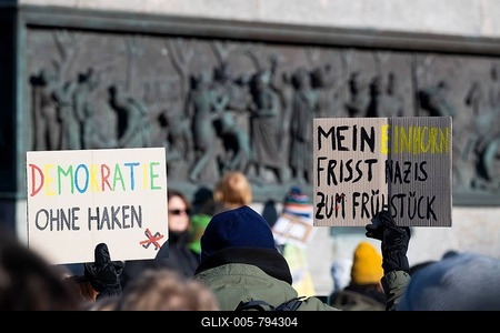 Pictures taken during the demonstration Haltung zeigen! against Nazi deportation plans of the AfD on the Schlossplatz in Stuttgart, 20 January 2024. A sign with the inscription Demokratie ohne Haken and Mein Einhorn eats Nazis for breakfast-stock-foto