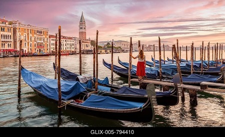 Woman with red dress looking at Venice, evening mood, sunset at the Grand Canal, gondolas at the pier, Campanile bell tower, Venice, Veneto region, Italy-stock-foto