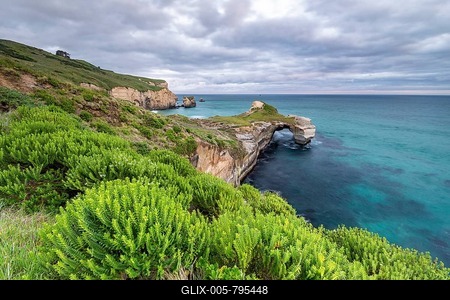 Rocky cliffs at Tunnel Beach, Dunedin, Otago, South Island, New Zealand-stock-foto