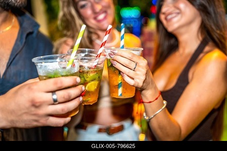 Friends enjoying refreshing cocktails together at a lively summer party, celebrating and having a good time-stock-foto