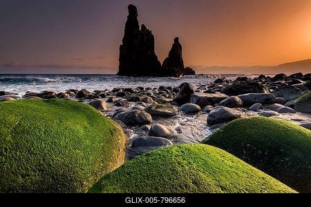 Rock formation Ribeira de Janela at sunrise with mossy stones on the beach, Porto Moniz, Madeira, Portugal-stock-foto