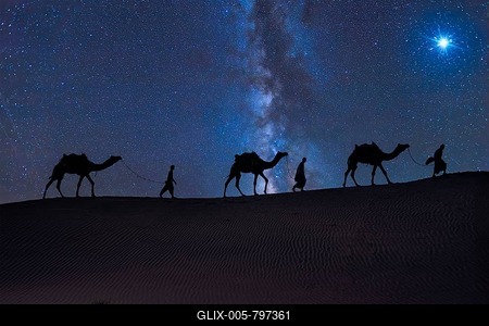 Christmas Jesus birth concept - Adoration of the Magi, Three Wise Men, Three Kings, and the Three biblical Magi with camel silhouettes journeying in sand dunes of desert follow Bethlehem star at night-stock-foto