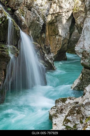 Waterfall on the emerald green wild river Soca, flows through narrow canyon, Soca Valley, Triglav National Park, Bovec, Slovenia-stock-foto