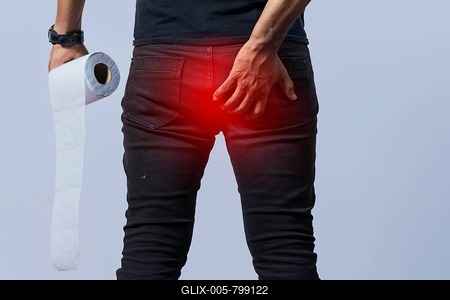 People with toilet paper in hand touching his buttock, Man with diarrhea problem, person with hemorrhoid problem on isolated background-stock-foto